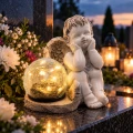 Znicz aniołek na grób z lampka solar szklana kula LED figurka nagrobna duży